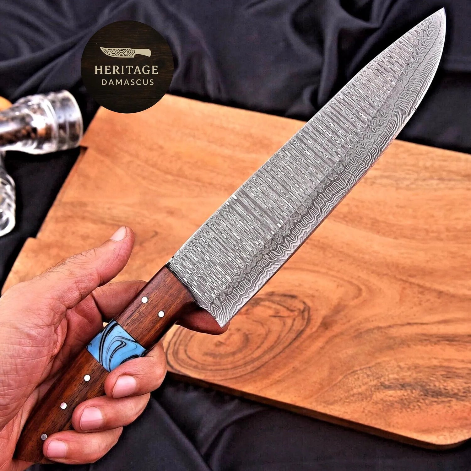 Hand-forged Damascus kitchen knife on a cutting board